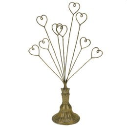 Gold card holder with heart-shaped stems, decorative metal display stand for photos and cards.
