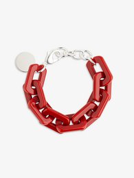 A gold-toned chain bracelet with a chunky, textured design. The bracelet features a mix of colors including red, blue, turquoise, black, brown, champagne, marble, and green.
