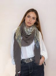 Soft, square scarf in a neutral color palette with a floral and animal print pattern. Made of a lightweight, breathable material for versatile wear.