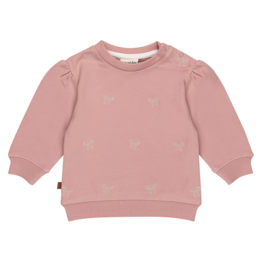 Soft pink baby sweater with bow detail, perfect for keeping little ones cozy and stylish. Made from high-quality materials for comfort and durability.