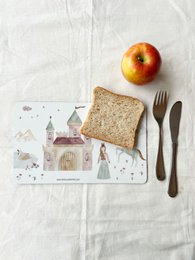 Decorative princess-themed snack board with castle, unicorn, and other whimsical elements. Suitable for serving appetizers, cheese, or other small bites.