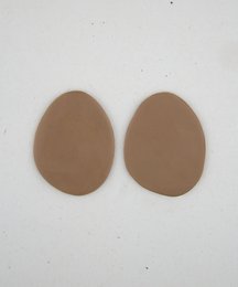 Oval-shaped drop earrings in a variety of neutral colors including olive, ocean, mist, earth, desert, and azure. The earrings have a simple, minimalist design.
