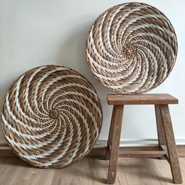 Set of 3 round, spiral-patterned woven wall decor trays in natural and white colors.