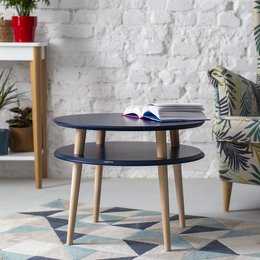 A round, modern coffee table with a diameter of 57cm and a height of 45cm, available in a variety of colors including Sea Green, Fleeting Mint, Gentle Blue, Antique Pink, Sage Green, Chalk White, Brown Beige, Broom Yellow, Beaver Brown, White, Pure Red, Petrol Blue, Navy Blue, Graphite, Concrete Grey, Pearl Grey, and Powder Pink.