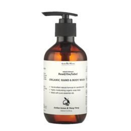 Organic hand and body wash with Sicilian lemon and ylang-ylang scents, in a glass bottle with a pump dispenser.