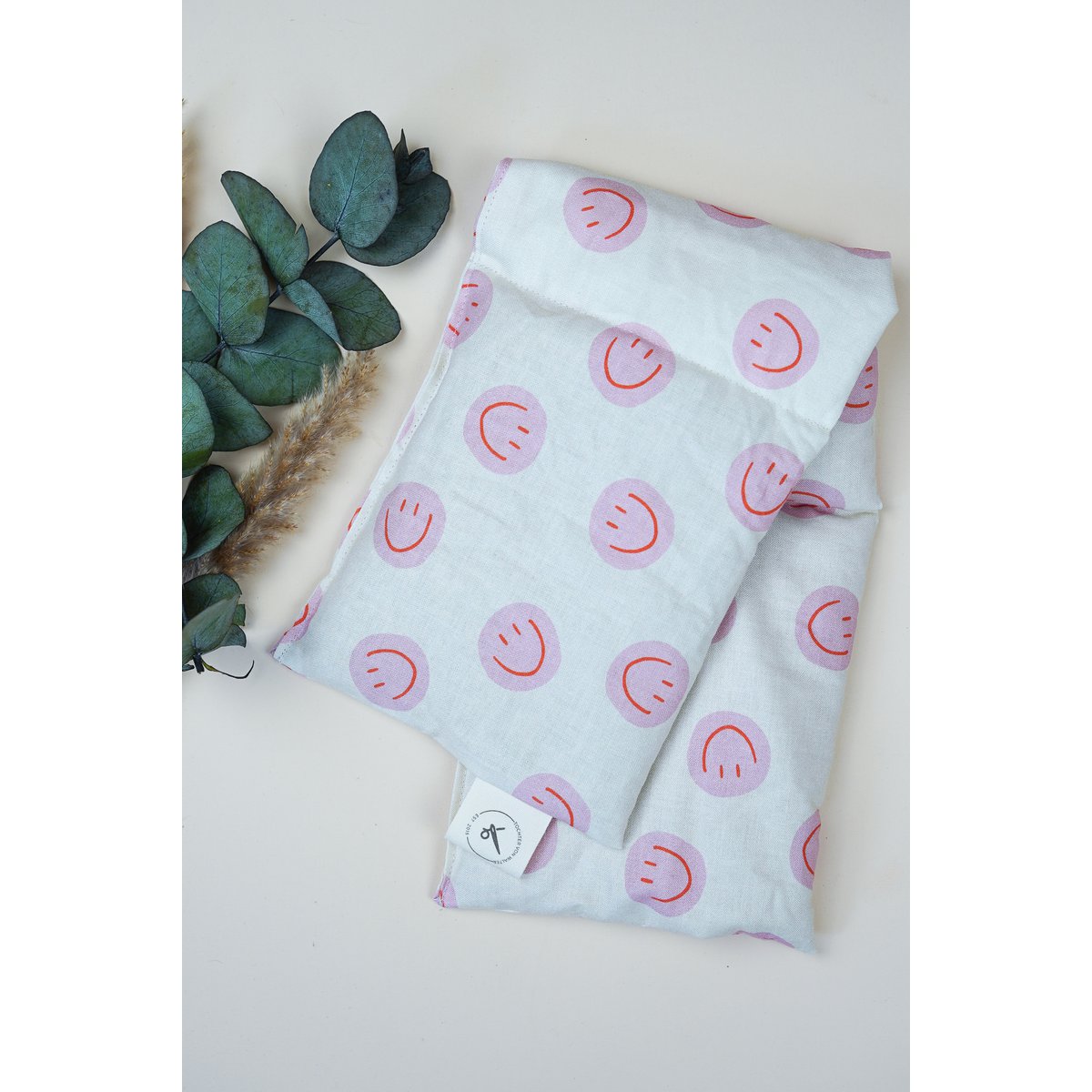Katoenen warmtekussen gevuld met biologische spelt Smiley Pink