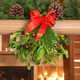 A set of 8 mistletoe bundles with red bows, packaged in a Christmas box. The mistletoe has green leaves and red berries, creating a festive holiday decoration.
