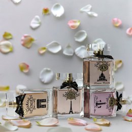  "Elegant perfume collection four bottles gold accents floral design luxury fragrance set ladies"