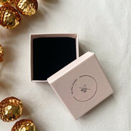 Elegant jewelry box with a sleek, minimalist design. Made of high-quality materials in a dark brown color. Suitable for storing and displaying various jewelry pieces.