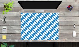 A blue and white diamond-patterned desk pad, suitable for office use.