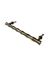 Bamboo brass grabbed large door knob, made of bamboo and brass materials, with a cylindrical shape and a textured surface.