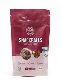Hazelnut and berry flavored snack balls, made with natural ingredients and suitable for vegans.