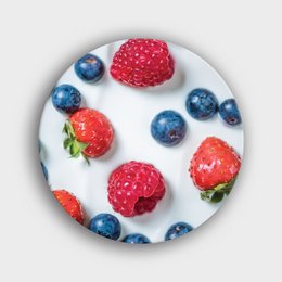 A round wall circle featuring a minimalist design with fresh fruit motifs including strawberries, raspberries, and blueberries.