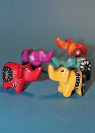Colorful soapstone elephant figurine, available in turquoise. Handcrafted with intricate details and patterns.