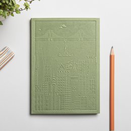 A hardcover notebook with a textured navy blue cover featuring the title "The New York Notebook". The notebook has blank pages inside and appears to be a high-quality stationery item.