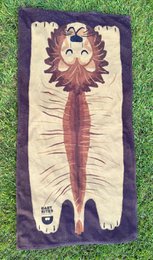  Plush animal-themed beach towel featuring a lion design with a vibrant color palette and textured elements.