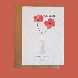A card with a floral design and the text "On seme" (We sow), suggesting a love-themed card or greeting.