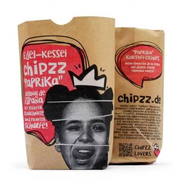 Spicy potato chips in a paper bag with a bold graphic design featuring a man's face. The chips are described as "Chipzz paprika" flavor.