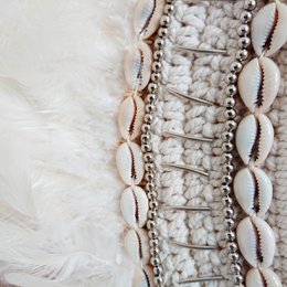Decorative necklace with feathers and shells