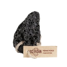 Pumice stone soap bar, natural exfoliating cleansing bar made from volcanic pumice, irregular black porous texture, suitable for body and face.