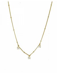 A delicate gold-toned necklace with a pendant featuring a circular design. The necklace has a layered look with a chain and additional charms or pendants.