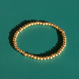 Aquilea – Armbandstapel aus Goldperlen
