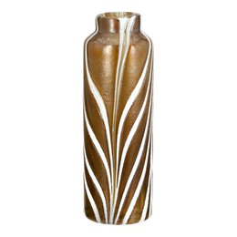 Tall, cylindrical vase in brown and white with a textured, striped pattern. Made of polyurethane material. Measures 27 cm in height.