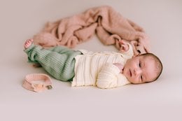 Soft, cozy pink diamond baby blanket for newborn.