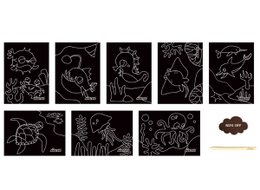 Scratch Art - Ocean is a creative arts and crafts kit featuring colorful ocean-themed designs. Scratch off the black coating to reveal vibrant underwater scenes including a fish, crab, coral, and more.