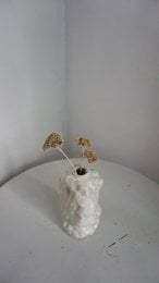 A handmade, matte gray vase with a simple, cylindrical shape.