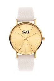 A 36mm gold-tone watch with a coconut milk-colored leather strap. The dial features the CO88 logo and a simple, minimalist design.
