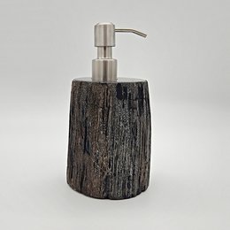 Petrified wood soap dispenser with a stainless steel pump. Rustic, natural design suitable for bathroom or kitchen.