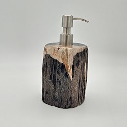  Rustic petrified wood soap dispenser with a natural, textured surface and a stainless steel pump.