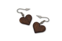 Geometric hanging earrings in leaf shape made of dark brown walnut wood, very light, matt oiled surface. Available in stainless steel silver and gilded stainless steel variants.