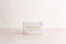 "Cards with inspirational text and minimalist design. Includes various cards with words like 'Ritual', 'Renewal', and 'Mindful'."