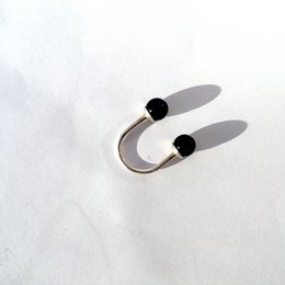 Two black statement rings with various size and color options, including silver and gold.