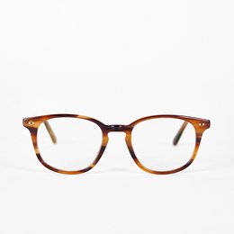 Tortoiseshell-colored round eyeglasses with an acetate frame.