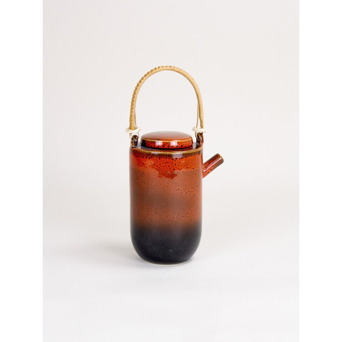 Laterite teapot by Hoa Bien with rattan handle
