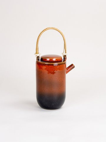 Laterite teapot by Hoa Bien with rattan handle