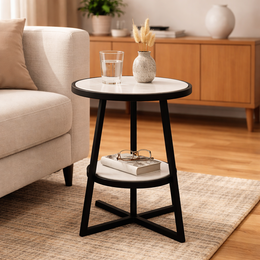 A round, two-tier side table with a marble top and an iron base.