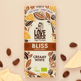 Organic and vegan white chocolate bar with a blend of cocoa butter, coconut, and vanilla. Features a rustic, nature-inspired design.