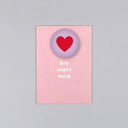 Colorful leopard-patterned magnet with postcard, featuring a pink heart shape.