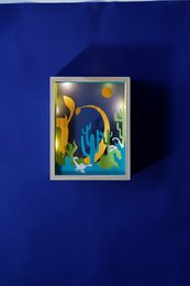 Colorful night light with a scorpion-like creature in a whimsical, underwater-themed design. Features vibrant blues, greens, and yellows.