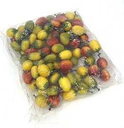 Colorful decorative mini tomatoes, red yellow green, small round balls, artificial fruit, craft supplies.