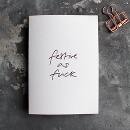 Festive hand-foiled greetings card with bold, playful text.