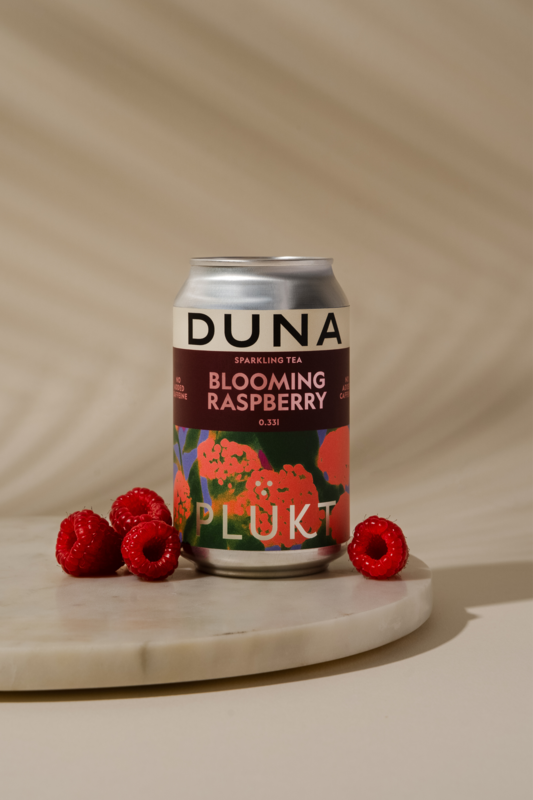 Mousserende urtete blomstrende hindbær