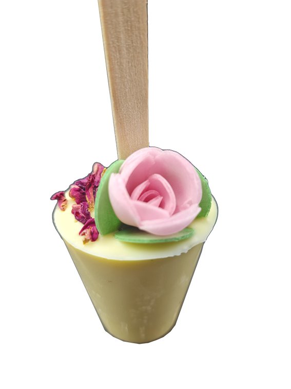 White drinking chocolate on a stick - rose, flower