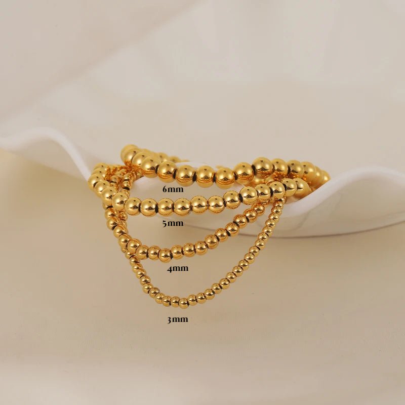 Aquilea – Armbandstapel aus Goldperlen