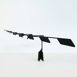 A wooden mobile toy with a balancing design, available in black or light brown colors. The mobile features various geometric shapes and forms that create a meditative and calming visual experience.