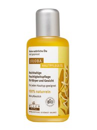 Organic jojoba oil in a yellow bottle. Moisturizing and nourishing for the skin.